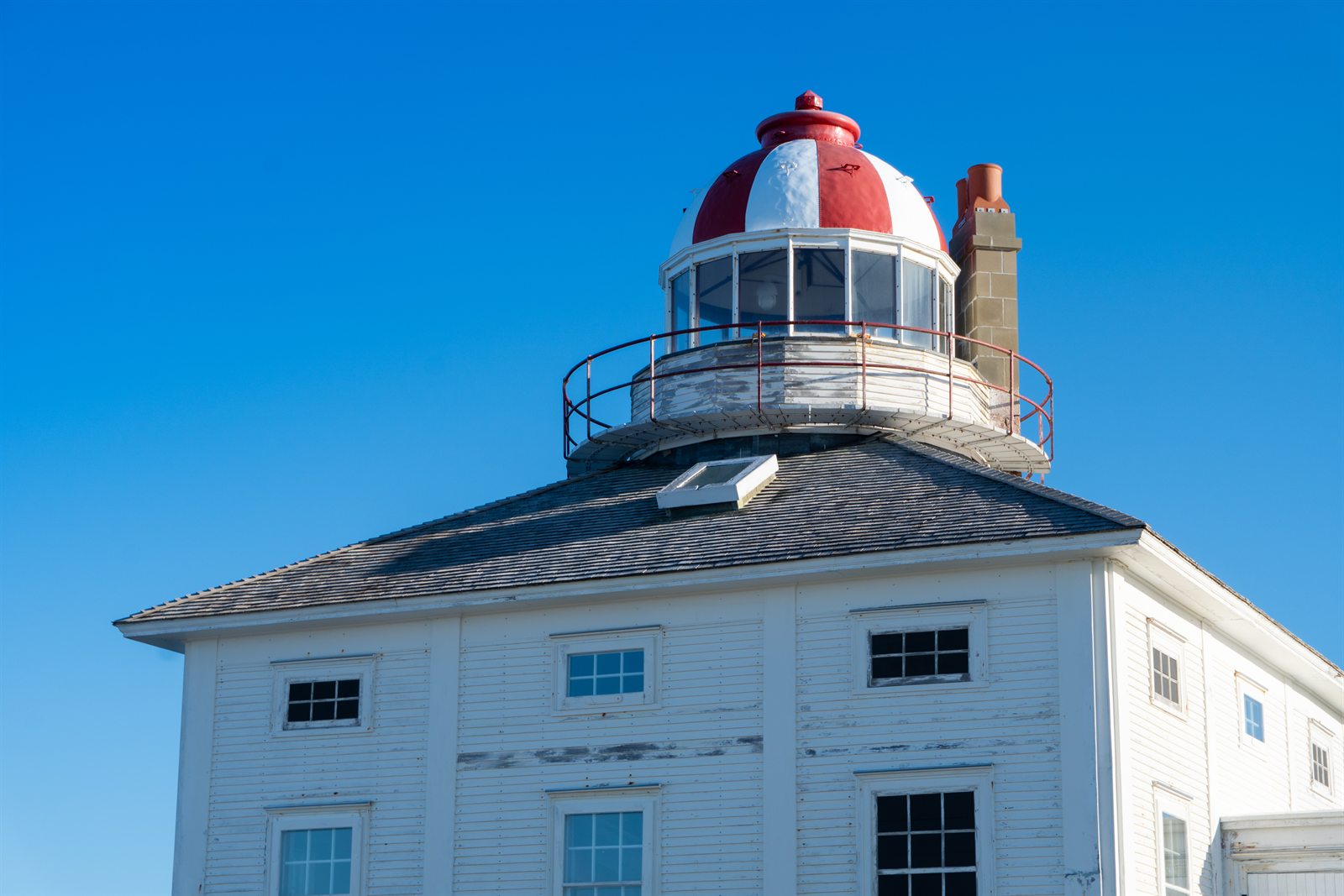 The red and white dome of the old Cape Spear lighthouse, Newfoundland.