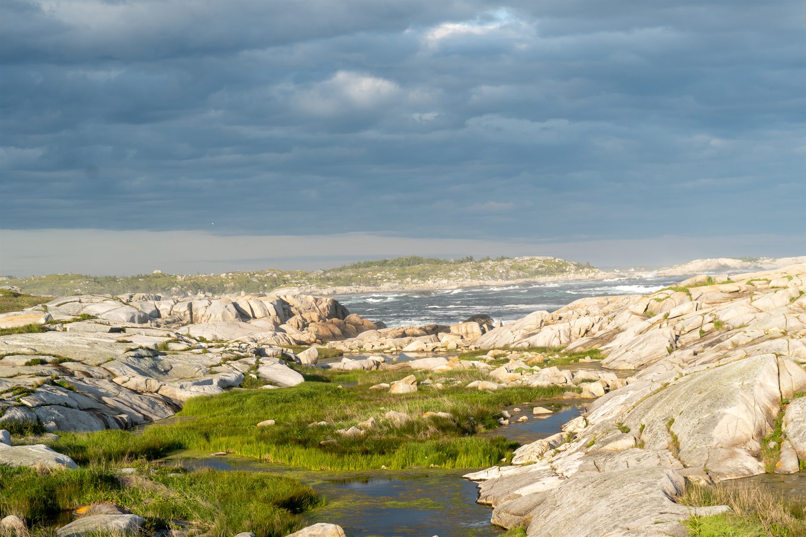 A tidal pool cutting through granite rock near Peggy's Cove.