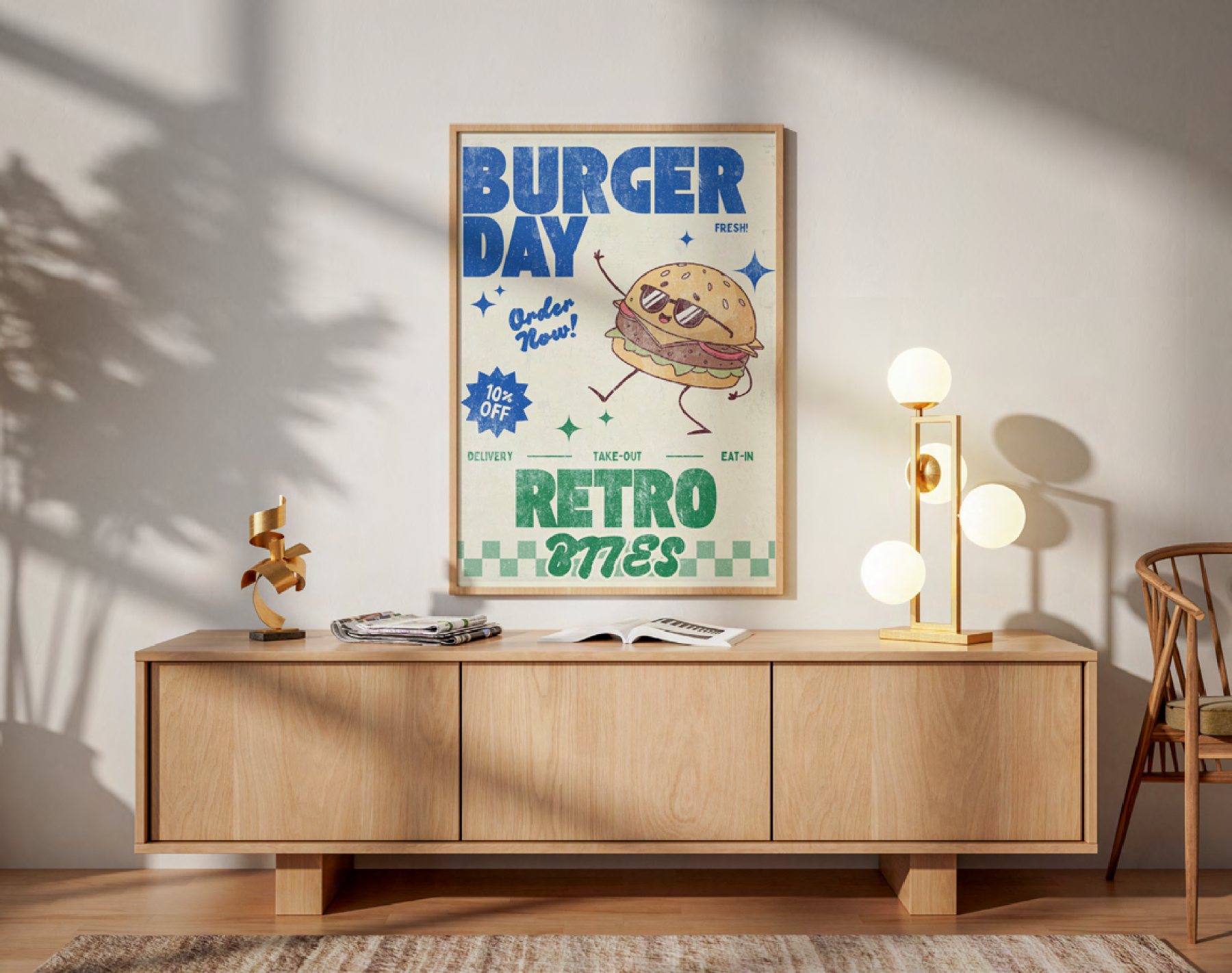 A framed Retro Bites “Burger Day” promotional poster displayed above a wooden sideboard in a bright room.