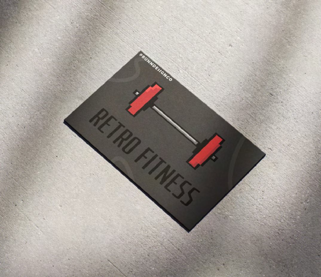 A dark grey Retro Fitness business card with a red dumbbell mark, photographed on textured fabric.